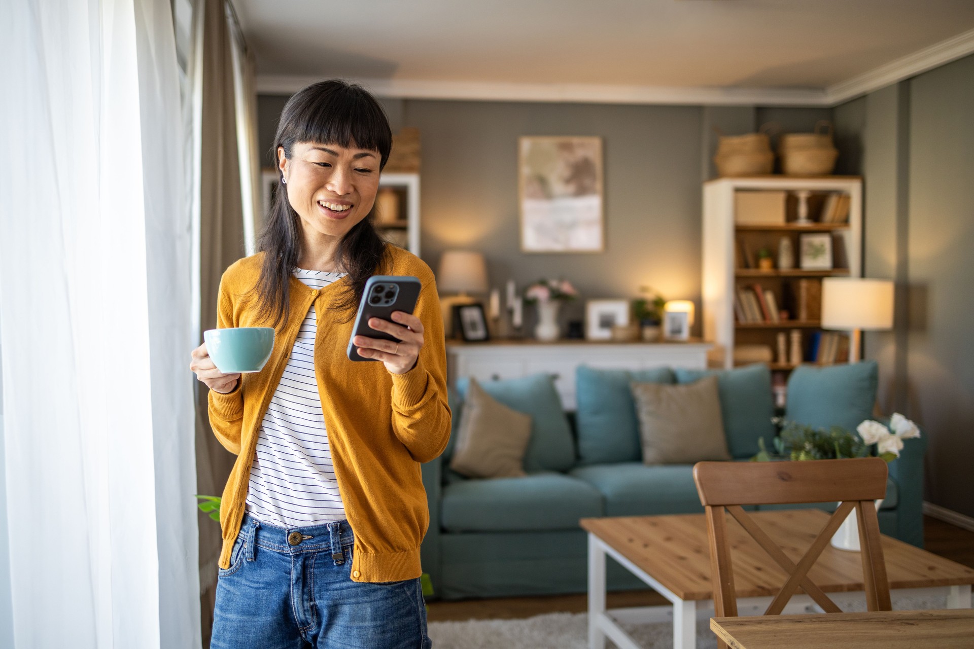 Japanese woman checks social networks on her phone